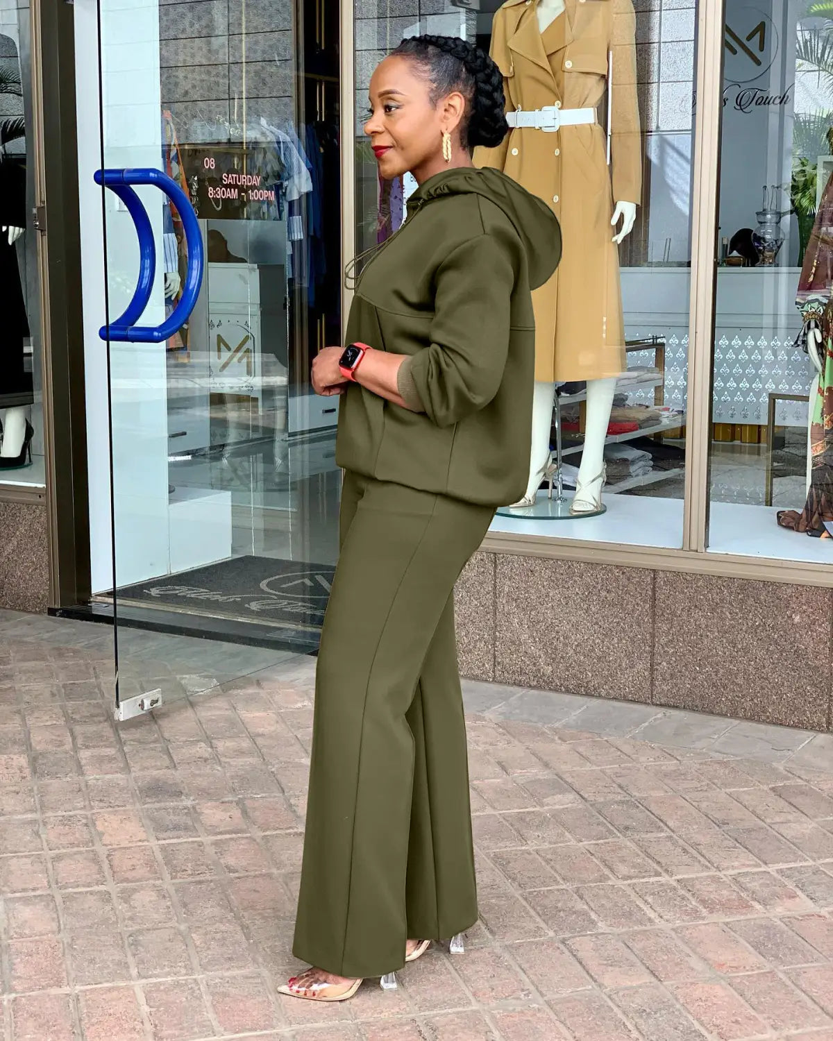 olive green solid color loose hooded sweatsuit with flared pants designed for casual wear
