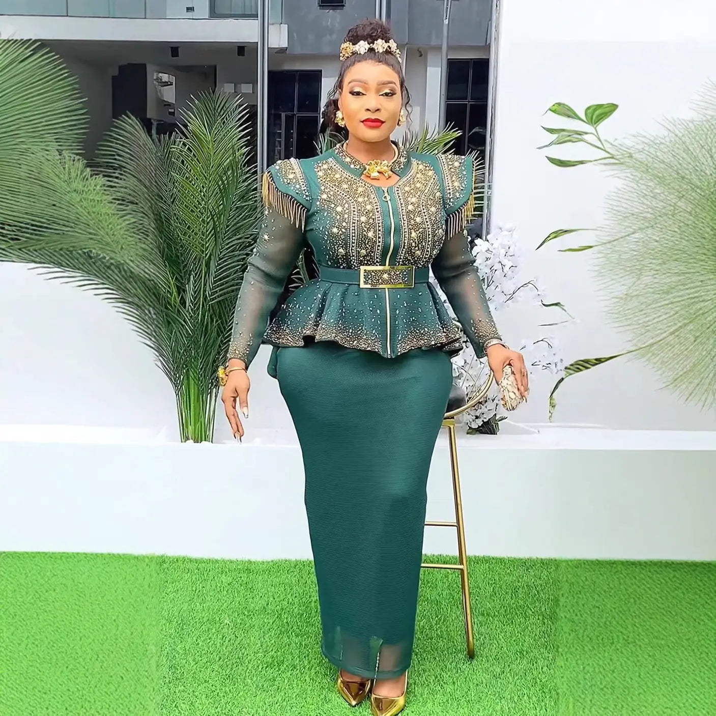 emerald green solid color hot drilling plus size two piece set featuring a peplum top with gold beading and sheer long sleeves paired with a matching high waisted skirt