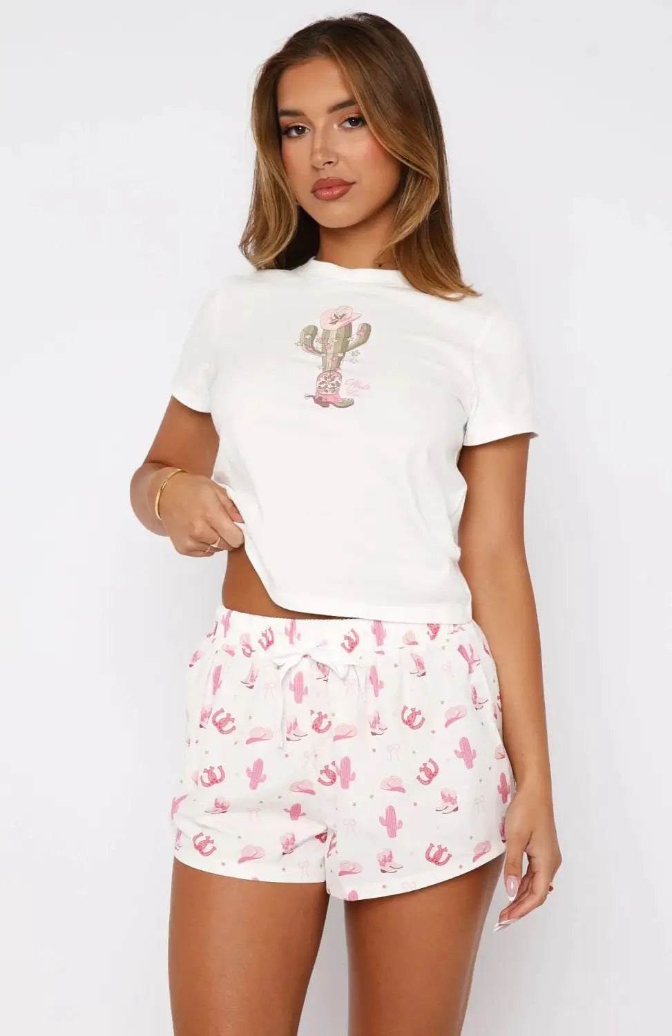 white short-sleeved crop top with pink cactus graphic on the front from shorts sweetheart pajamas printing suit designed for comfortable sleepwear.