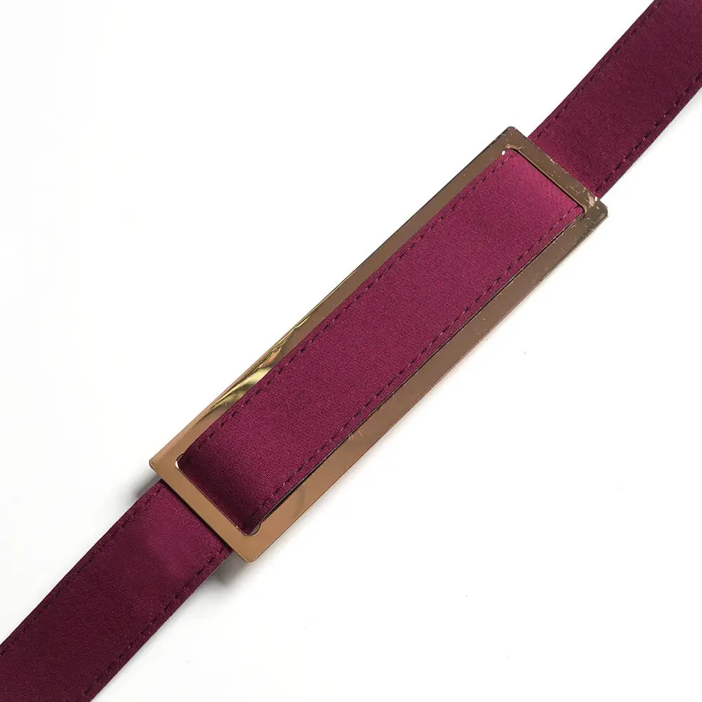 a sleek burgundy satin belt with a rectangular gold-tone metal buckle as part of a solid color hot drilling plus size two piece set
