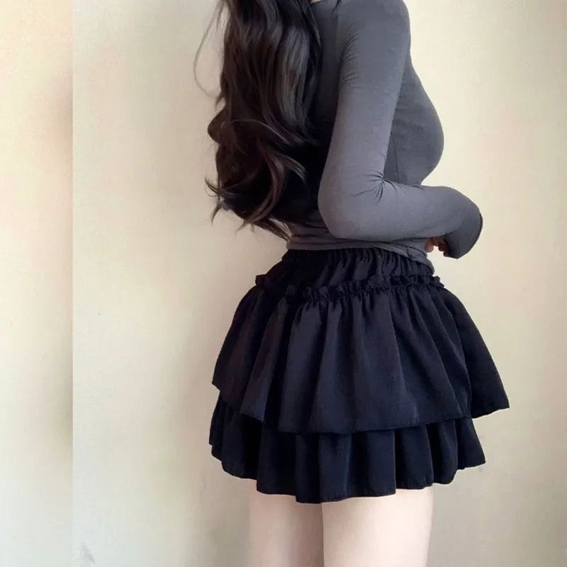Black two-tiered ruffled pure desire style pettiskirt with elastic waistband designed as a slimming ballet skirt.