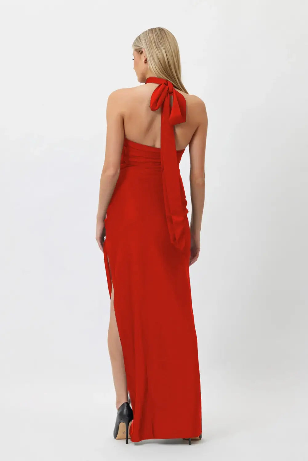 a vibrant red satin white ribbon flower halter gown featuring a flowing back tie and high slit for elegant evening style