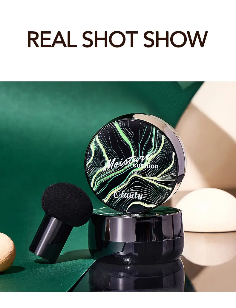 Ivory marbled air cushion foundation with sponge featuring a black and green marbled moisture cushion compact with a sleek glossy finish for cream foundation application.