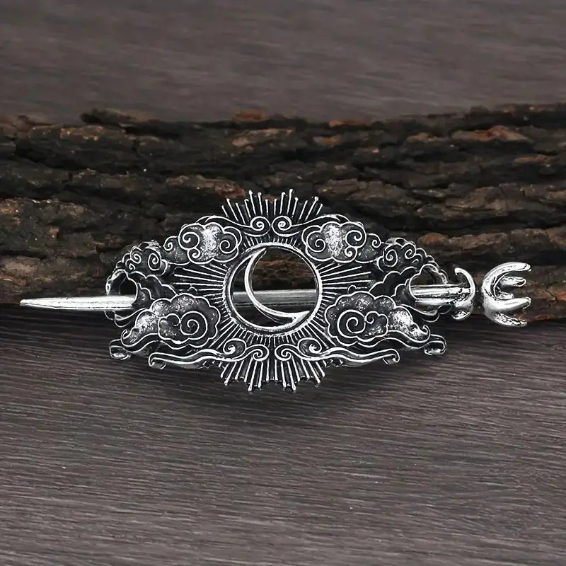 Silver-toned metal female viking barrettes featuring an intricate crescent moon design surrounded by swirling cloud patterns and radiating sunburst lines in alloy material.