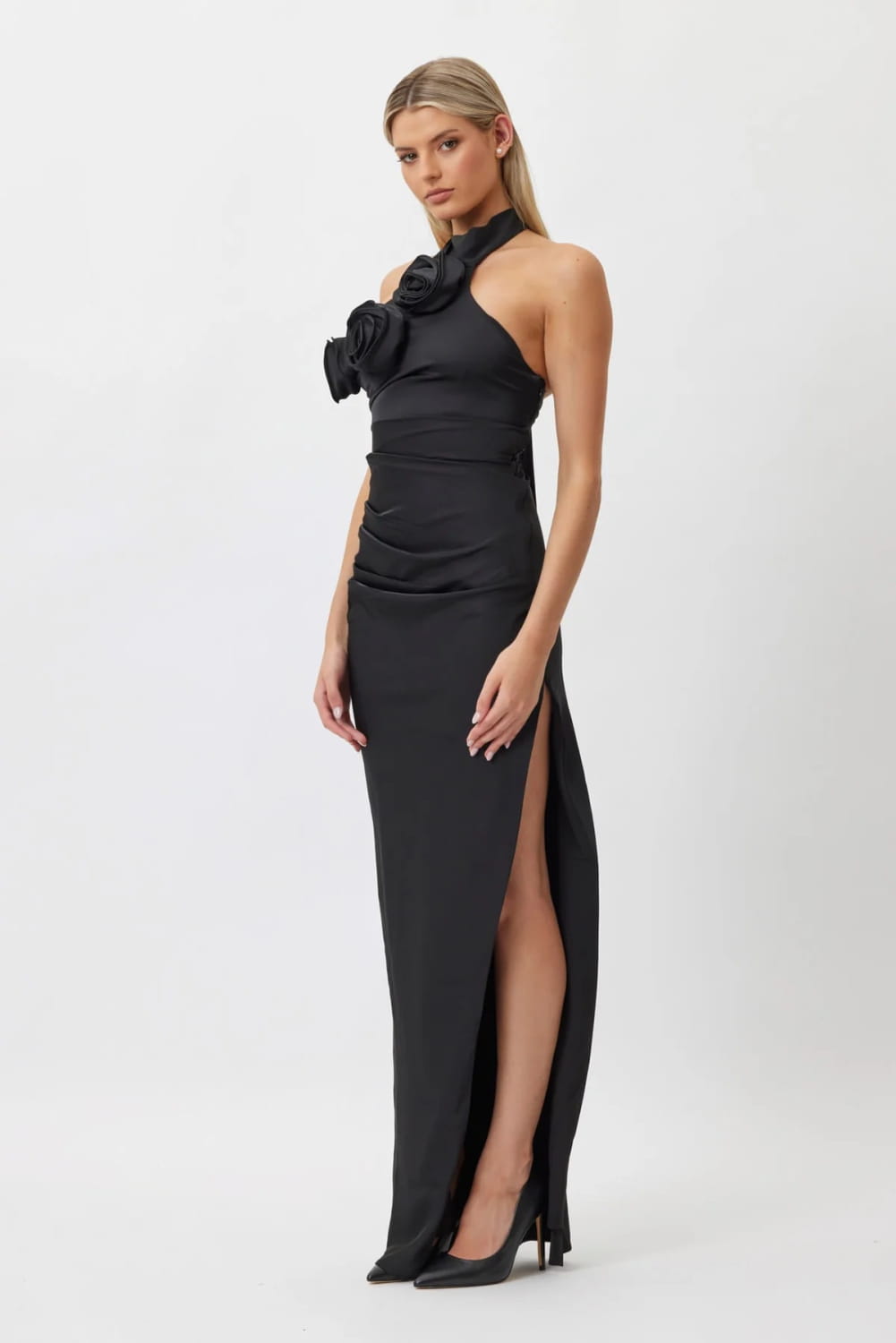 black satin halter-neck gown with ruched bodice and large white ribbon flower embellishment at the neckline in style white ribbon ribbon flower halter design