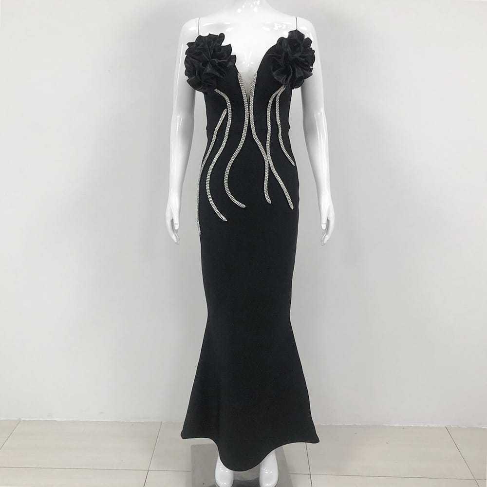 black temperament socialite flower chain evening dress in mermaid style featuring large ruffled floral embellishments at the shoulders and silver beaded accent lines down the front.