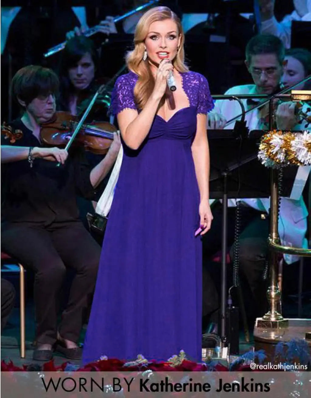 Katherine Jenkins wears a long elegant purple wedding gown featuring eyelashes lace stitching and lace stitching Japanese cotton with lace short sleeves and a fitted bodice.