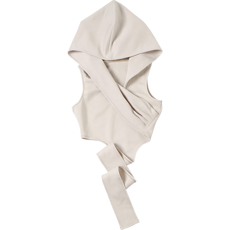 Cream stylish short crop hooded wraparound top in beige featuring a sleeveless design with a draped asymmetrical front and long tie straps perfect for short crop tops.