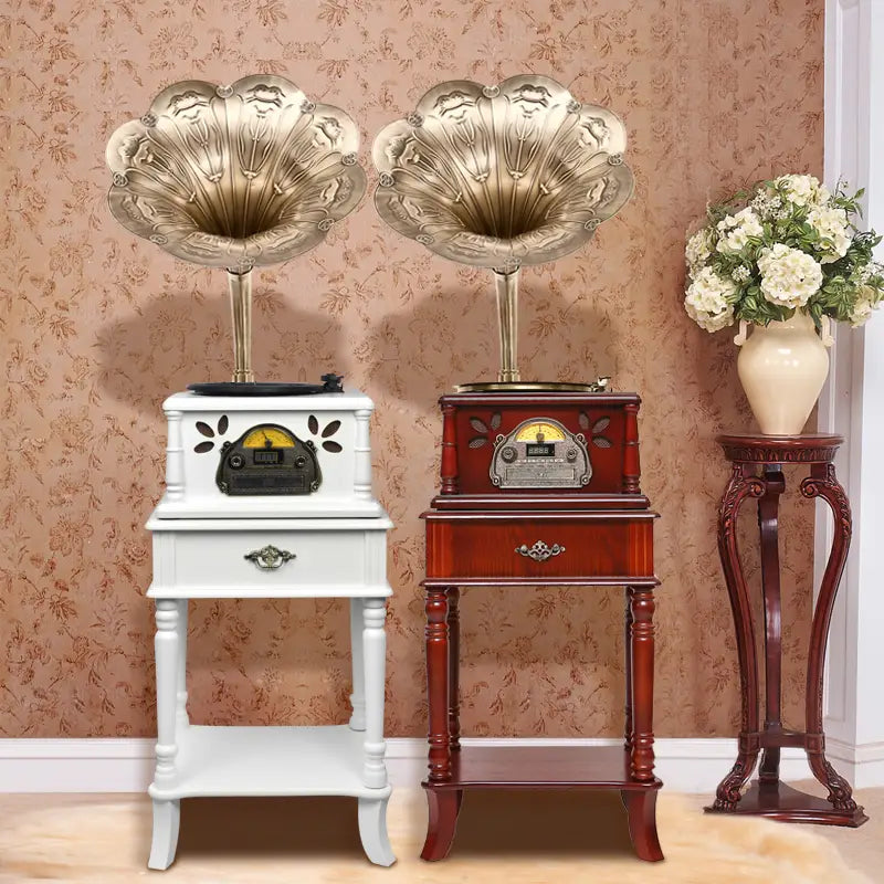 two vintage-style gramophones with ornate gold-toned conical horns and matching wooden cabinets in white and dark red featuring small drawers and decorative metal accents for classical living room tea stereo use