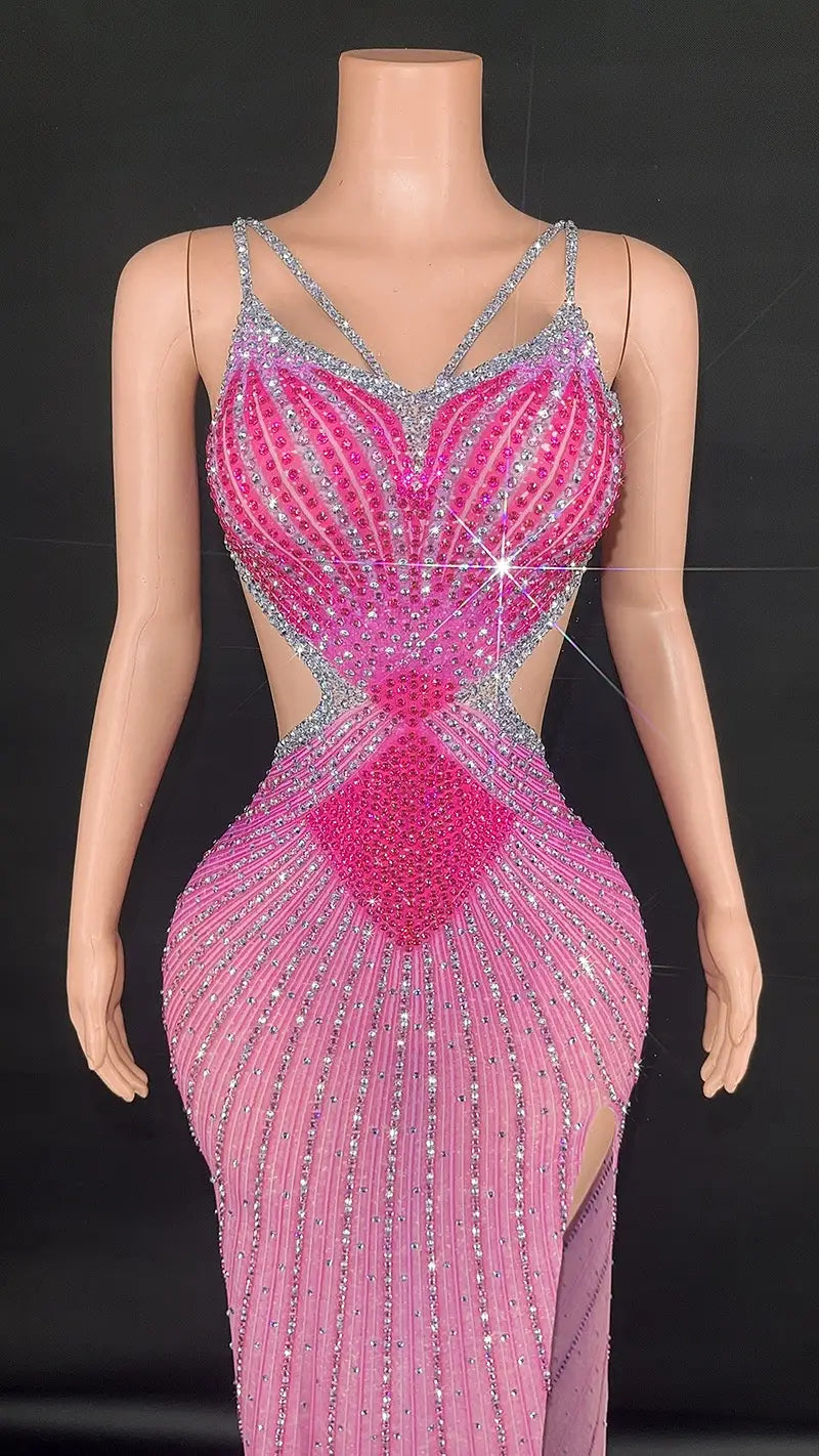 a dazzling pink and silver sling super shiny beaded evening gown featuring intricate geometric patterns, sheer mesh panels, and a plunging neckline.