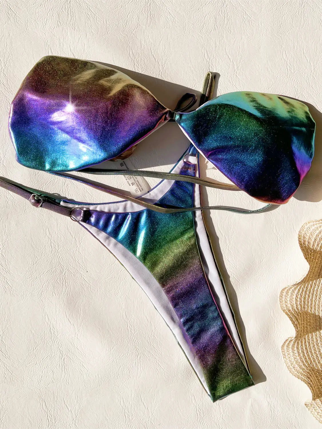 Iridescent rainbow bikini gradient swimsuit featuring a holographic bikini gradient set with a shimmering rainbow gradient finish.