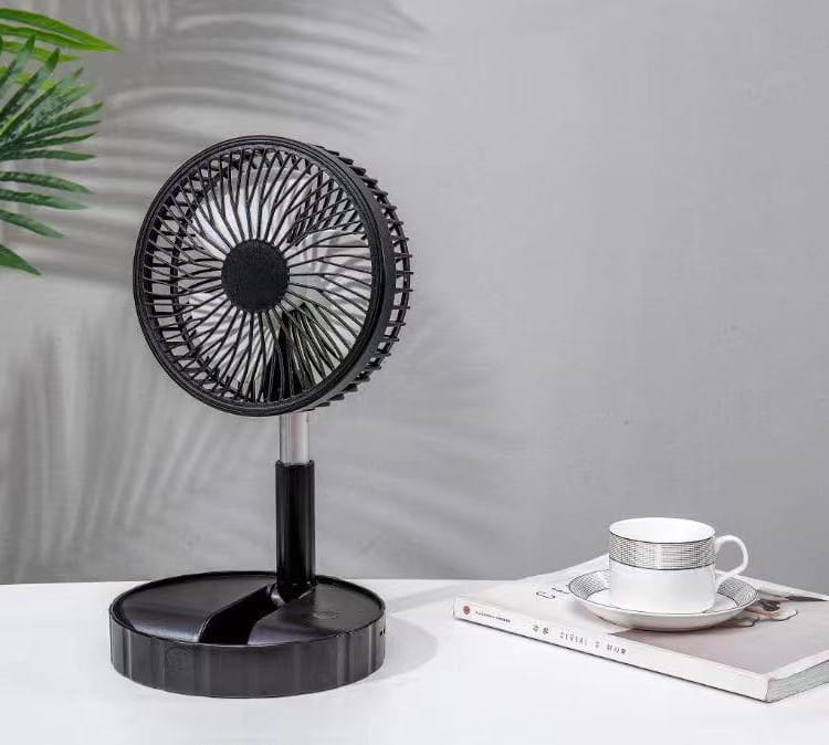 Black portable telescopic folding fan with a sleek circular design and metallic stand designed for quiet portable telescopic use