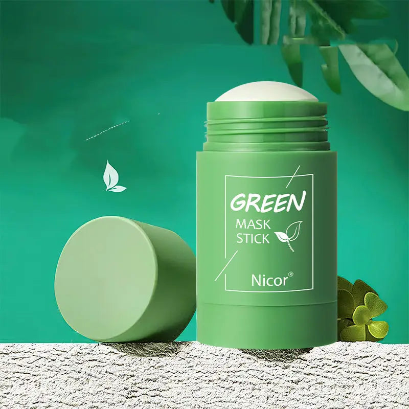 a matte green cylindrical container with a matching lid labeled green mask stick by nicor for cleansing green tea and eggplant oil control mask stick