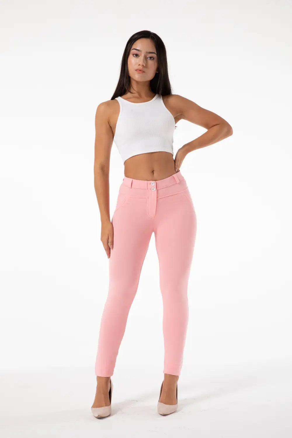 a pair of high-waisted form-fitting blush pink melody hot shaping leggings with button closure and belt loops designed for hot shaping leggings effect