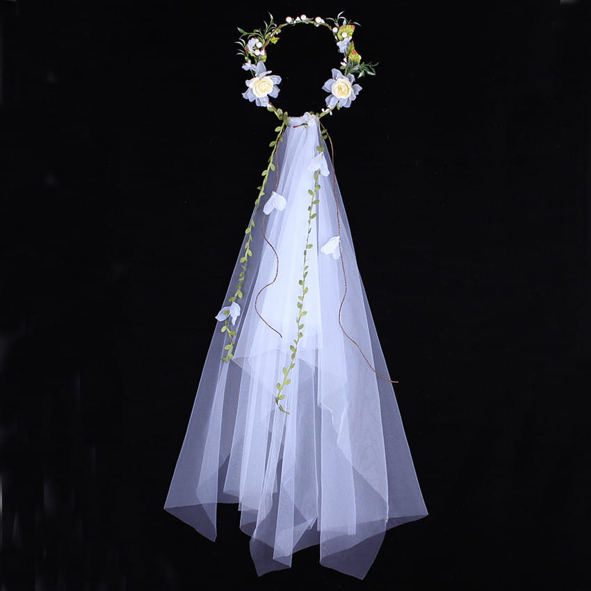 handmade white rose bridal veil featuring a delicate white floral crown with a flowing sheer veil embroidered with green vines and small flowers.
