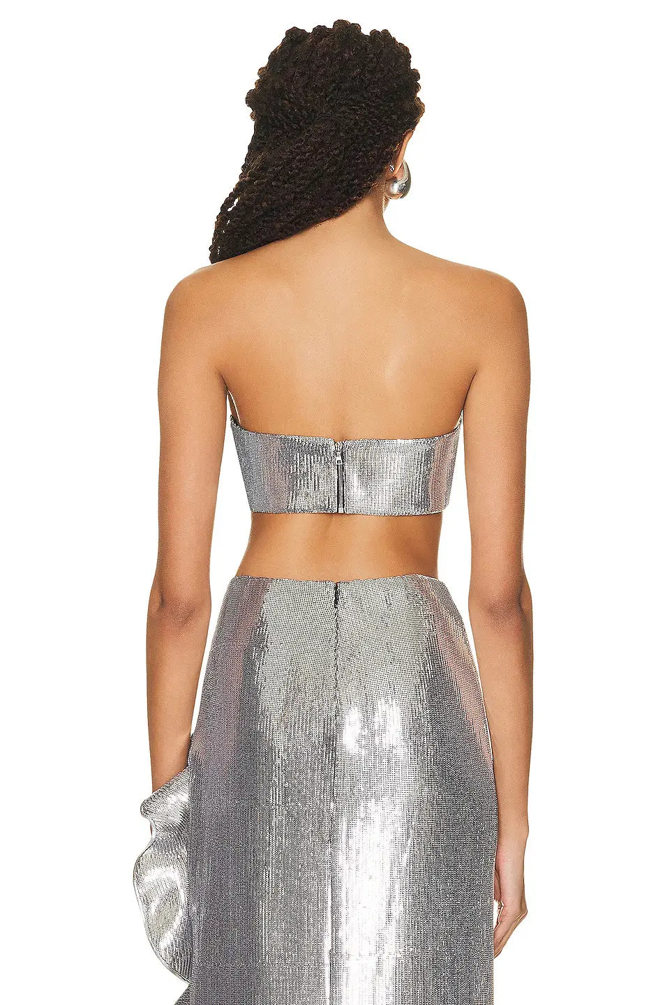 Shiny silver metallic strapless top with a fitted structured design from a silver sequin skirt set.