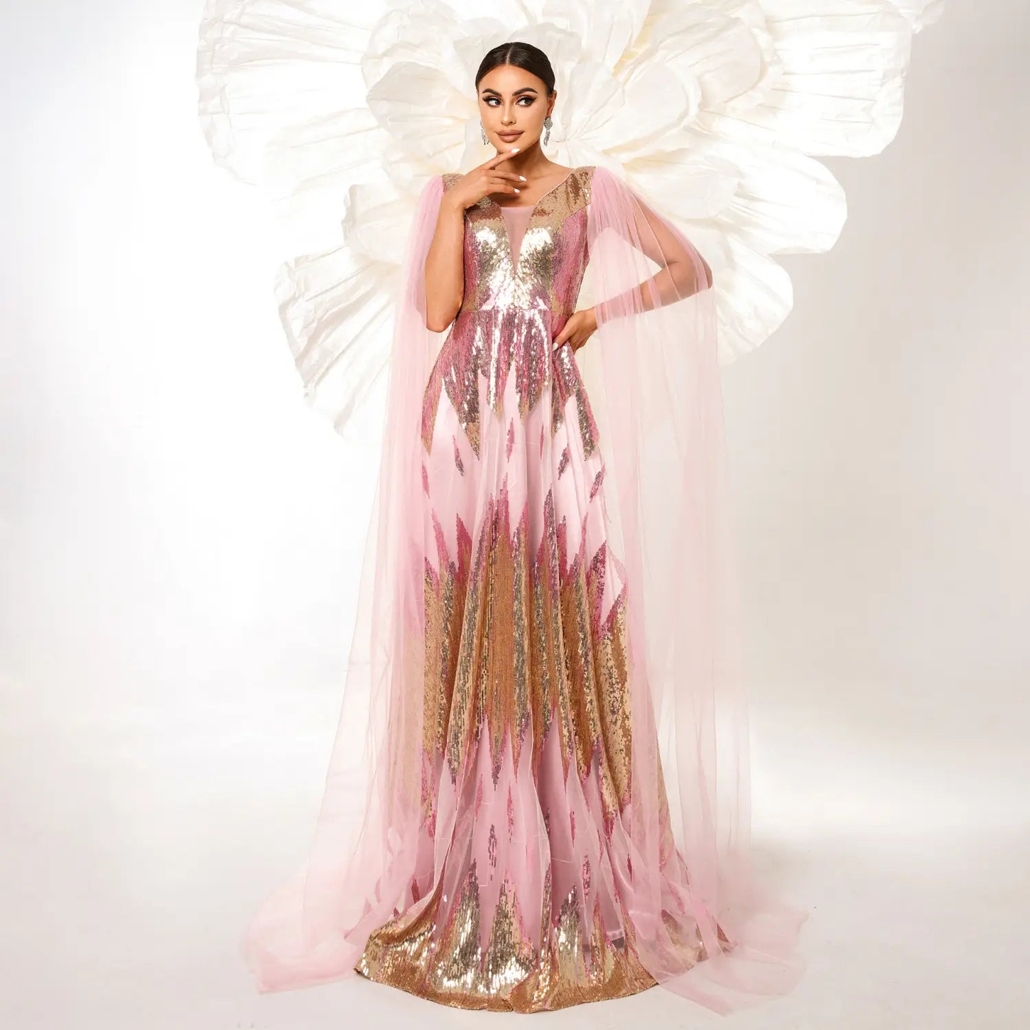 a flowing pink and gold mesh long sleeve sequins large swing dress with a sheer capelet.