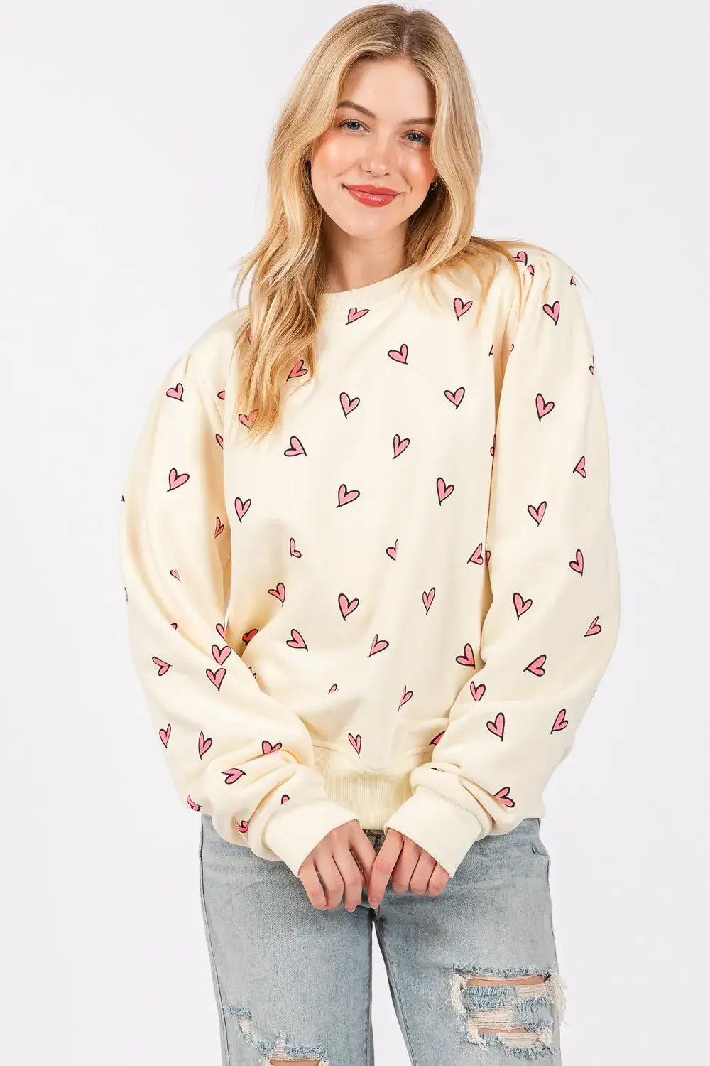 cream-colored sage fig heart printed long sleeve sweatshirt with soft cozy texture and all-over pink heart print