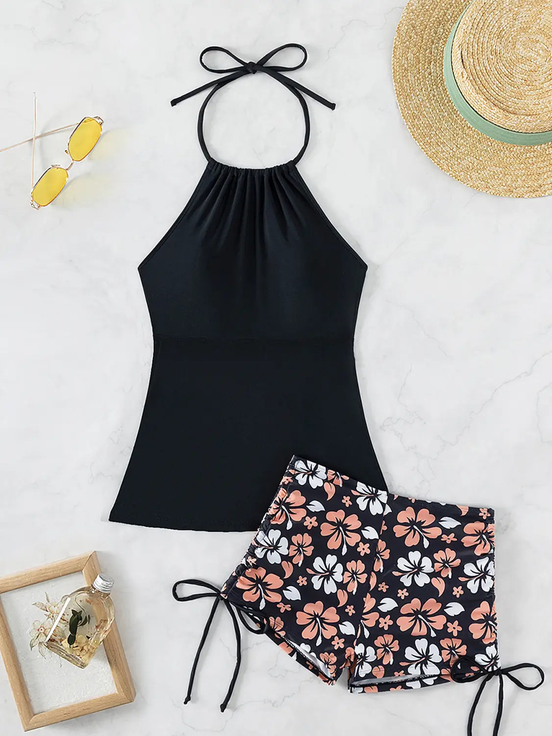 black halter top split swimsuit with gathered neckline and adjustable tie-back straps in a floral halterneck printed halter bikini design
