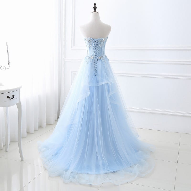 Light blue slim fit bridesmaid gown with a delicate tulle fabric, corseted bodice, lace detailing, and silver beading, ideal for an annual meeting or tied slim fit events.