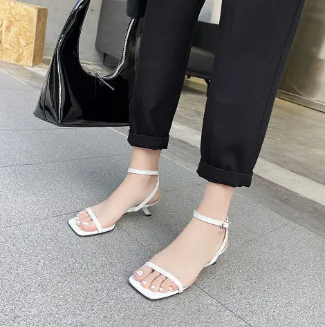 white square toe ankle strap heels with a slender square toe stiletto heel and minimalist design featured in green minimalist square toe block heel sandals collection.