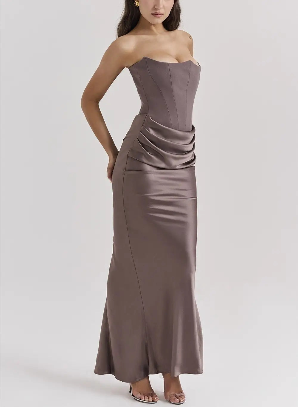 A sleek strapless mermaid long dress in metallic taupe satin fabric with a structured bodice and draped detail at the waist perfect for dress sexy fashion and sexy fashion bandeau styles.