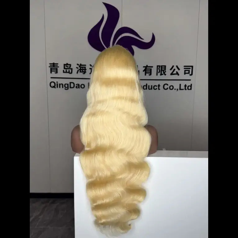 blonde wavy human hair wig with natural-looking voluminous texture displayed on mannequin head 30 inch hd 13x4 hot sale blonde human hair