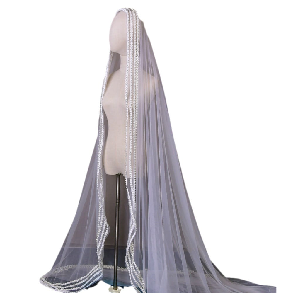 a delicate translucent white yarn wedding bridal veil with intricate beaded trim and a broadband hair comb for trailing yarn wedding use