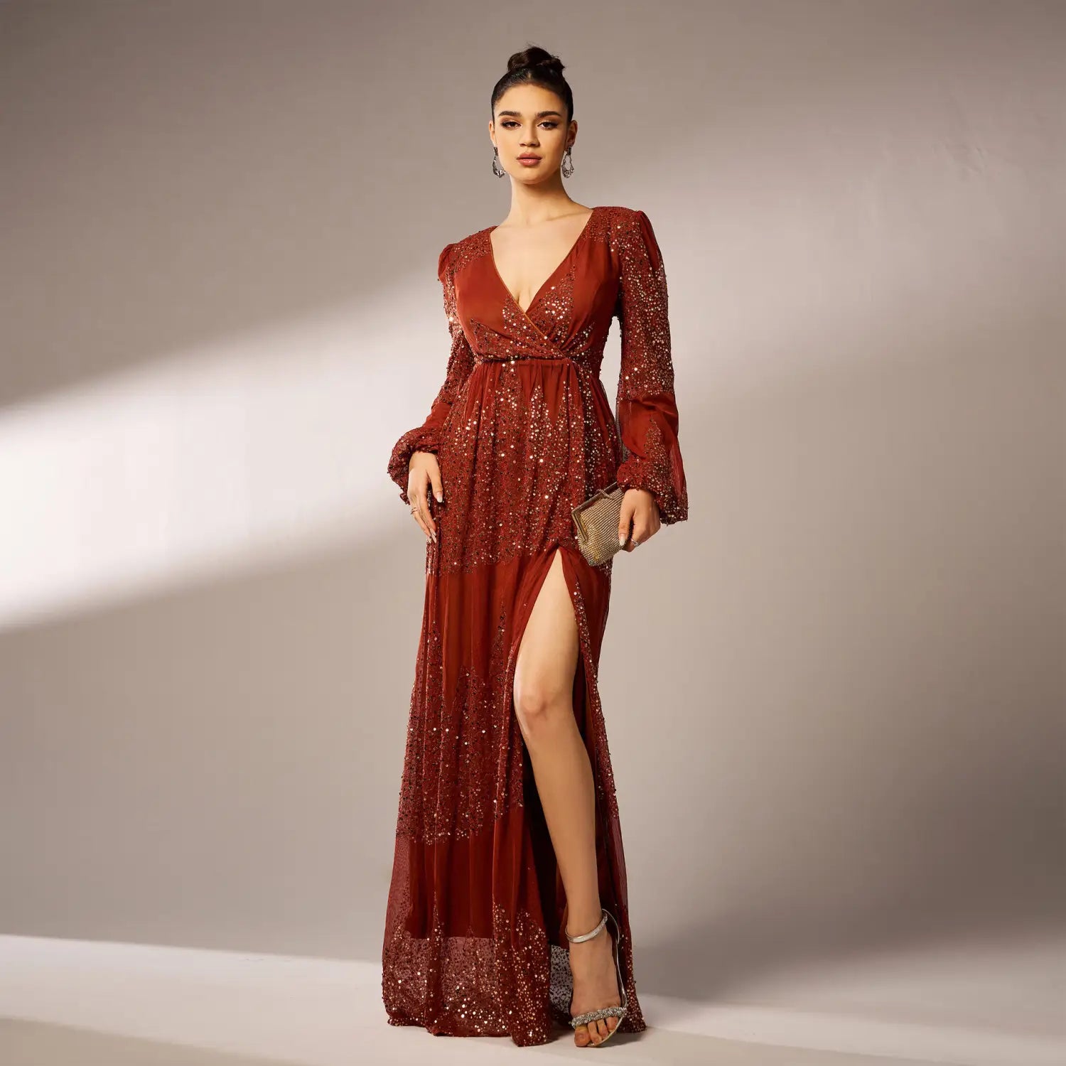 a shimmering burgundy sexy long sequined evening dress with long bell sleeves and a high slit designed for formal occasions