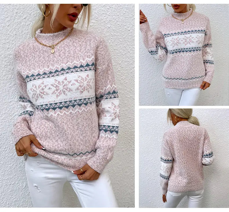 A cozy light pink knit winter snowflake sweater with a festive white and dark gray snowflake pattern and a fashion half turtleneck design.