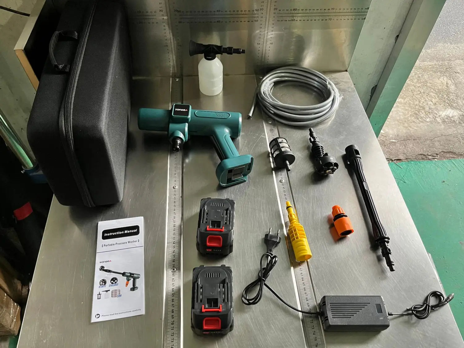 teal and black multifunctional car wash cordless pressure washer with interchangeable nozzles and accessories for wash high pressure applications