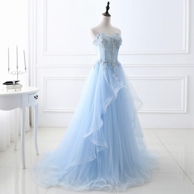 A delicate light blue slim fit bridesmaid gown with intricate silver beading on the strapless bodice crafted from layered tulle fabric ideal for an annual meeting.
