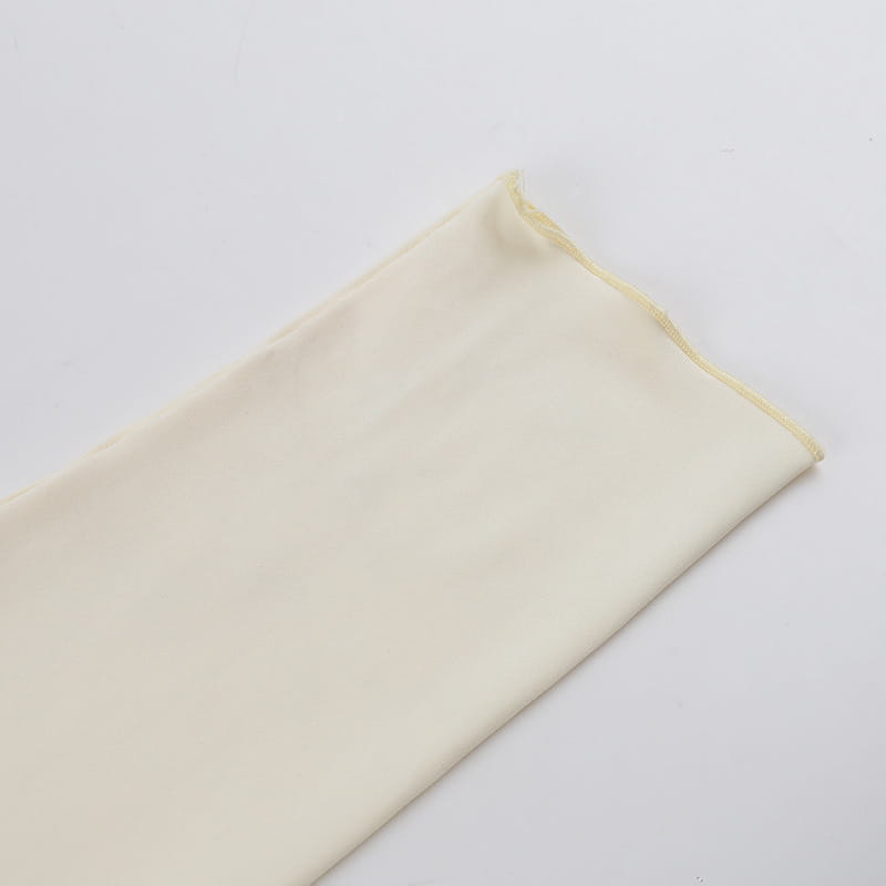 a soft off-white fabric with a smooth texture and neatly finished edges featured in an elegant slim print floral top and skirt set with print round neck design