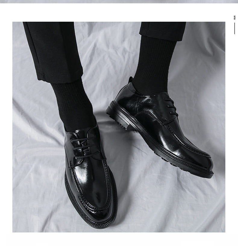 black patent horsebit loafers male with a glossy finish, lace-up design, and textured rubber soles, ideal for male fashion formal wear.