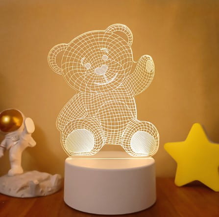a glowing white 3d wireframe teddy bear lamp with a soft warm light emanating from its base featuring colorful touch remote control lights for versatile illumination.