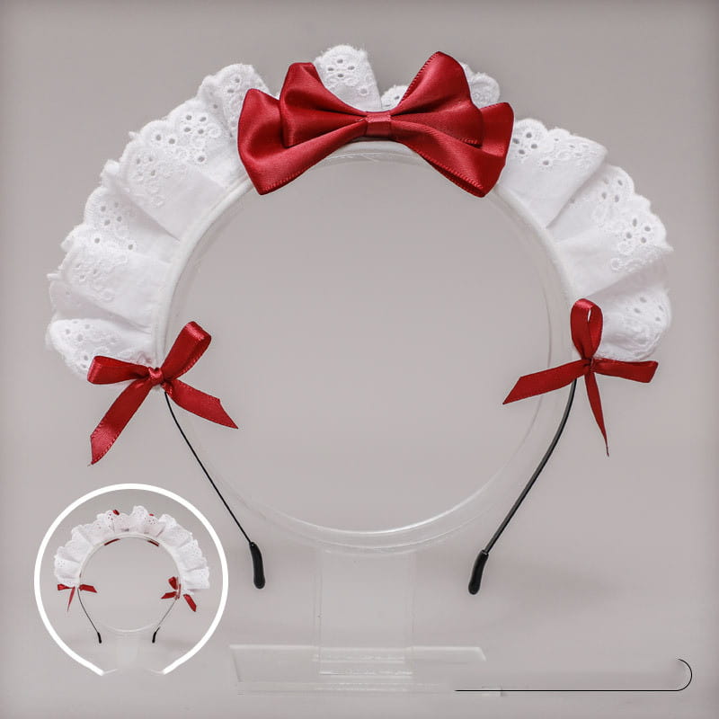 White lace bow maid headband featuring a central red satin bow and two smaller matching bows on the sides.