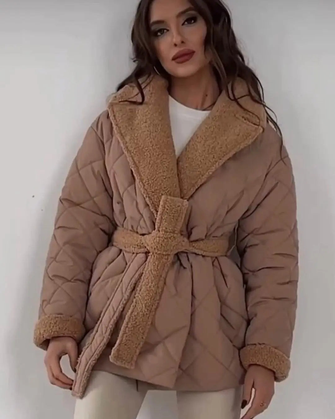 Beige winter lapel plaid coat featuring a quilted design with a plush tan shearling collar and cuffs and a matching belt for stylish plaid coat fashion.