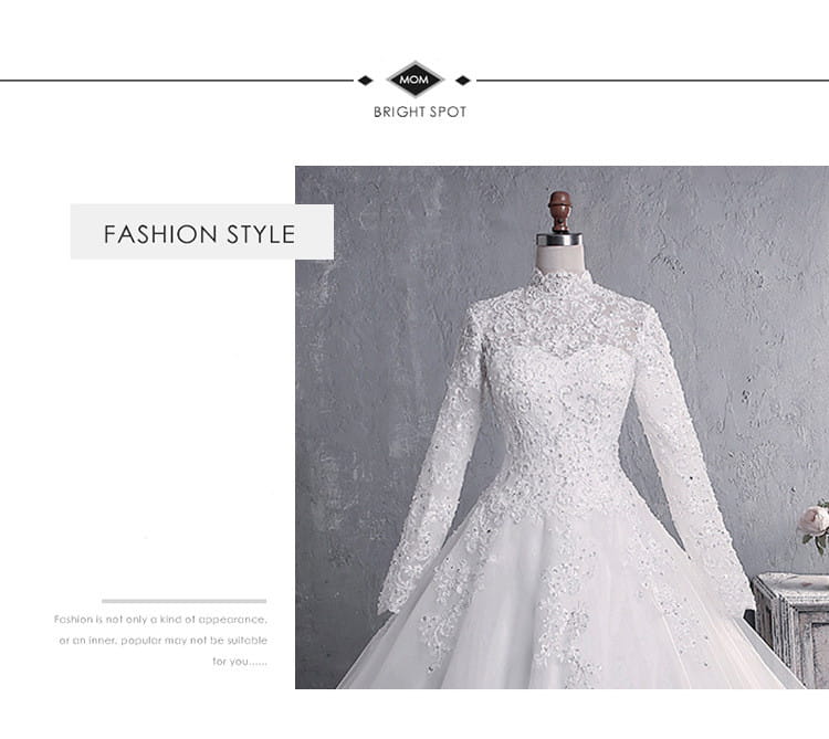 White lace wedding dress bridal gown with long sleeves high neckline intricate beading along the bodice and skirt featuring a large tail large for elegant weddings
