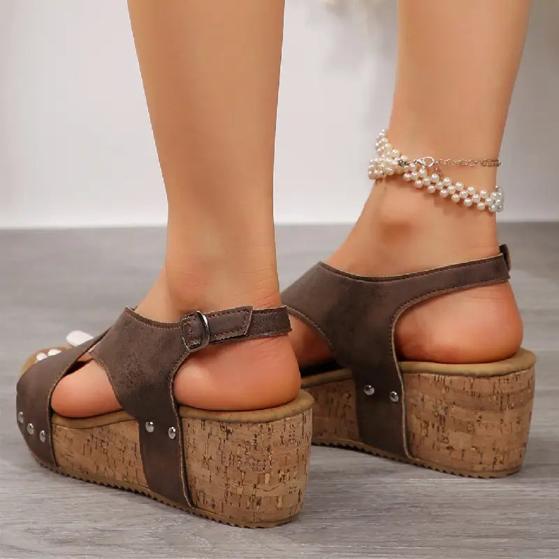 beige suede rivet wedges snadals featuring brown suede fish mouth shoes with cork soles and silver studs