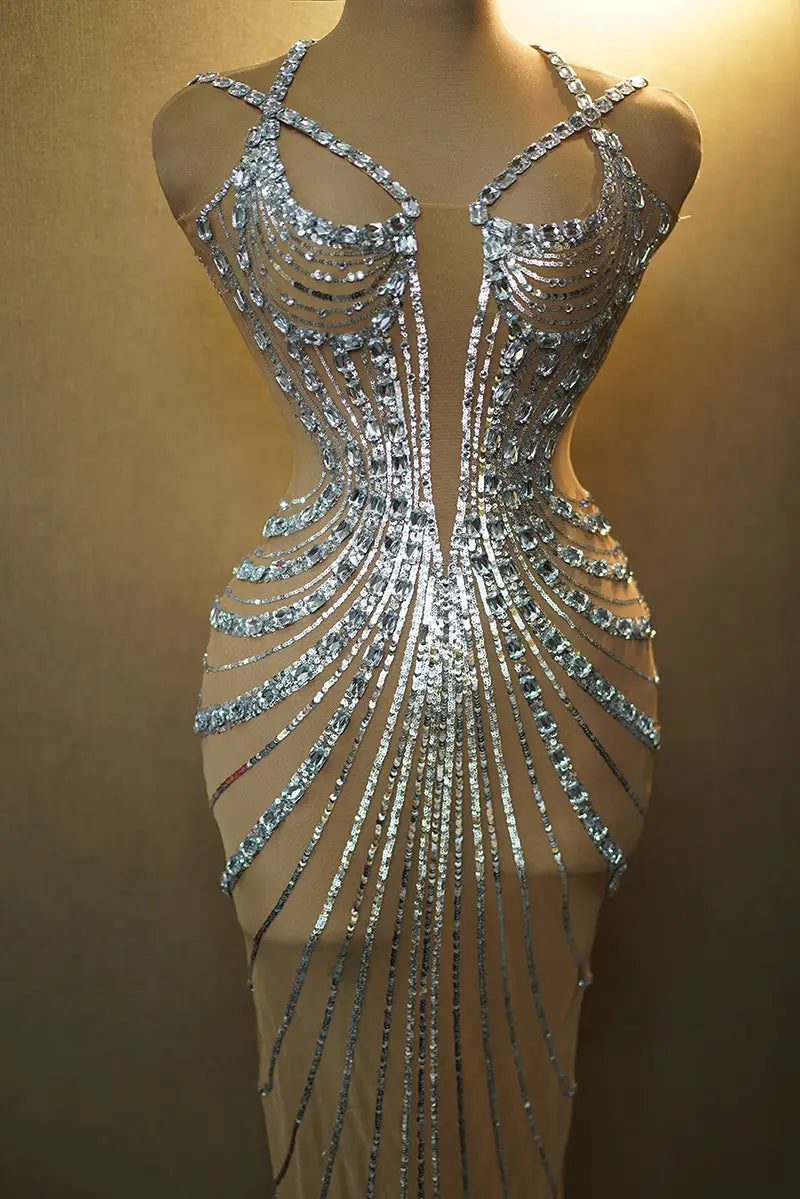 A shimmering silver rhinestone feather dress banquet gown featuring intricate cascading rhinestone embellishments forming a radiant feather-like design down the front.