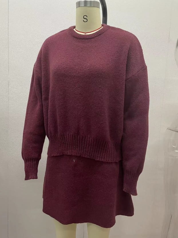 maroon knit sweater dress with ribbed cuffs and hem displayed on a mannequin as part of long sleeve sweater skirt sets casual pieces