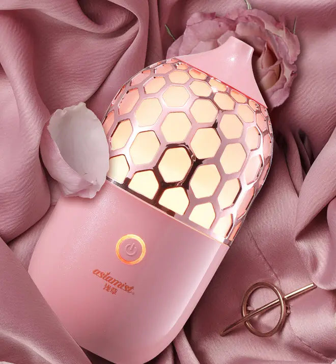 asakusa pink aroma diffuser in pink features a honeycomb-patterned rose-gold mesh top and a smooth matte finish for elegant essential oil diffusion.