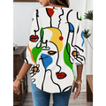 White casual office blouse with abstract face pattern in black outlines and bold red yellow green blue accents and long sleeves