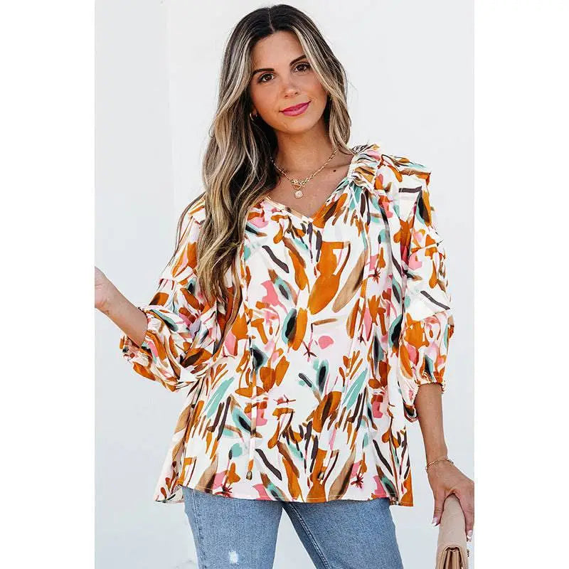 A vibrant fashion colorblock printed chiffon shirt women featuring a colorful abstract floral print in orange pink and green