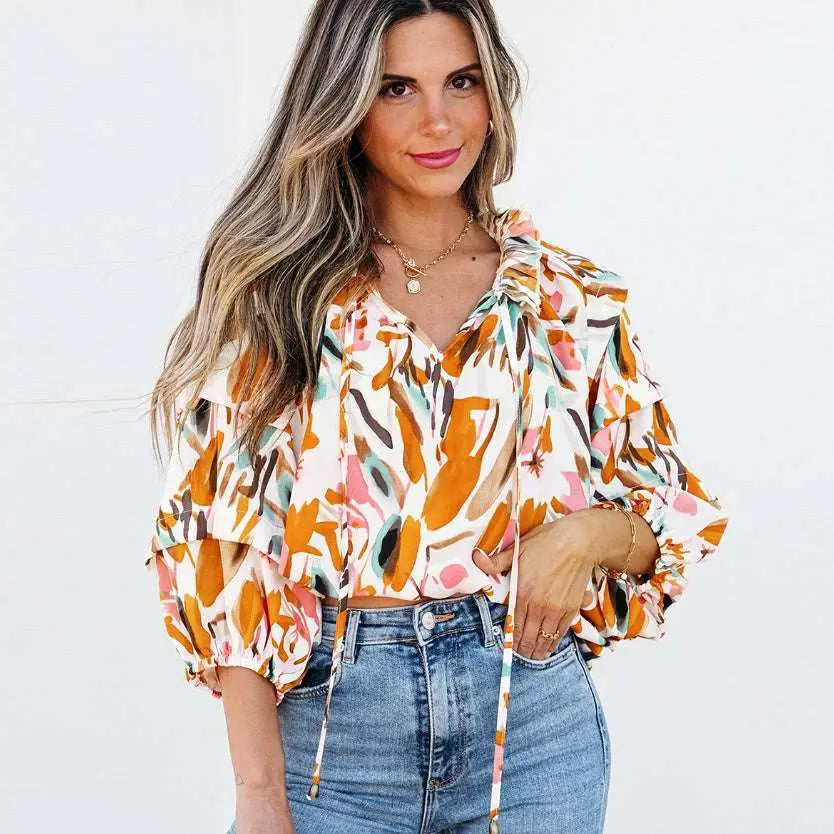 A vibrant fashion colorblock printed chiffon shirt women featuring a colorful abstract floral print in orange pink and green