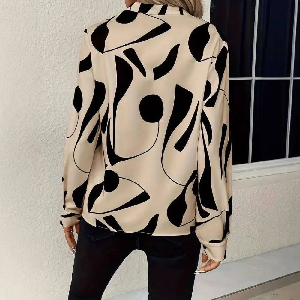 Beige abstract printed notched collar shirt long sleeve with bold black geometric patterns and a formal design