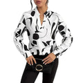 A woman wearing a white shirt long sleeve with bold black abstract printed notched collar shirt design