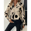 Cream-colored abstract printed notched collar shirt long sleeve with bold black geometric patterns and a formal fit