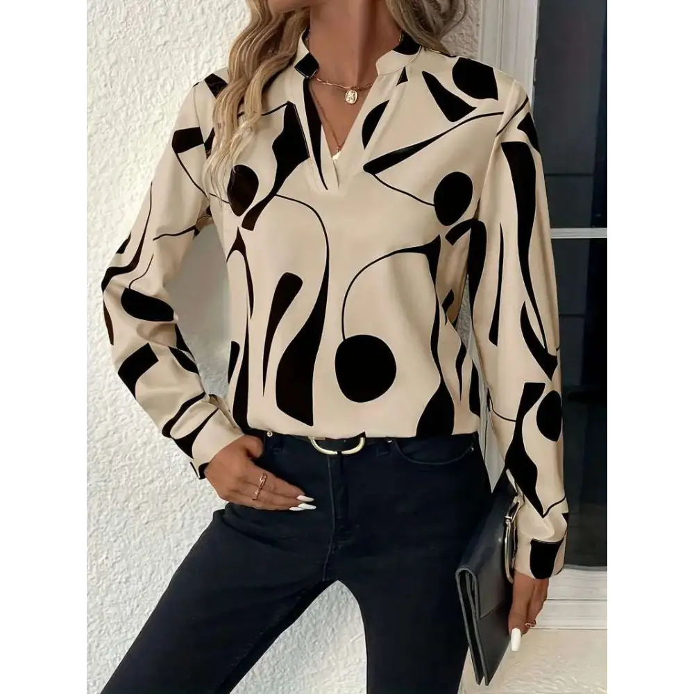 Cream-colored abstract printed notched collar shirt long sleeve with bold black geometric patterns and a formal fit