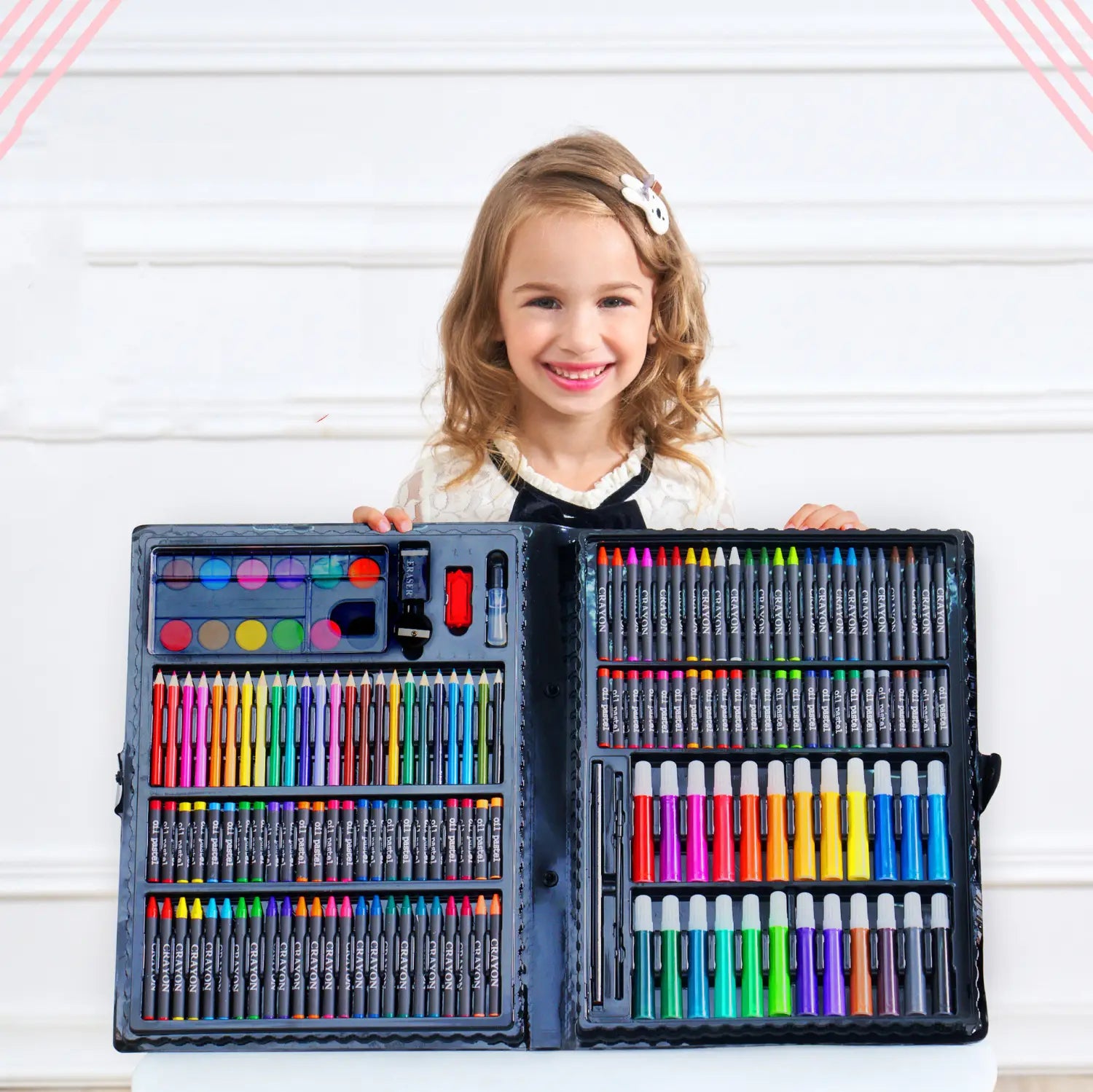 a black open art kit featuring a comprehensive watercolor pen and painting set with a wide array of colorful crayons and markers neatly organized in compartments